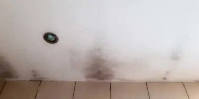 Mold on ceiling due to missing insulation.