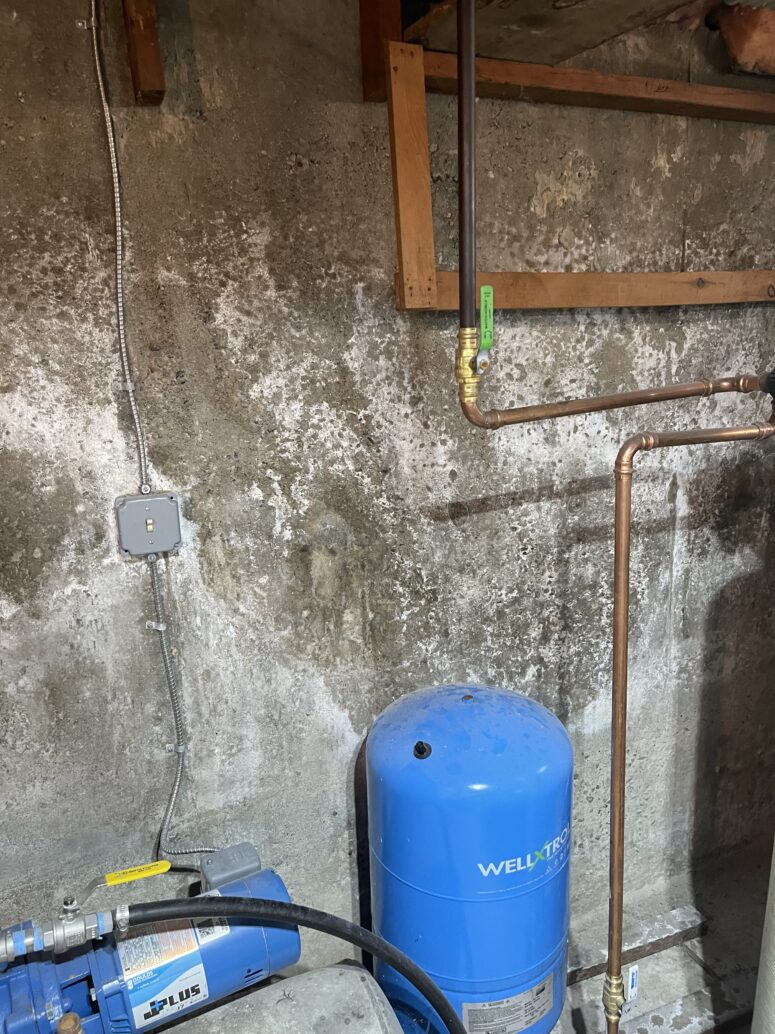 White efflorescence on a basement wall.